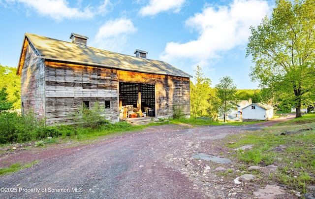 87 Old Farm Ln, White Haven, PA 18661 - view of property exterior featuring an outbuilding and a chimney