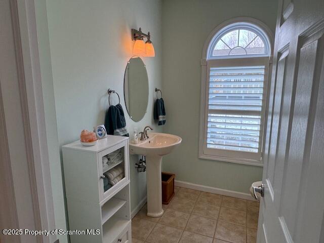 bathroom with sink and tile patterned floors