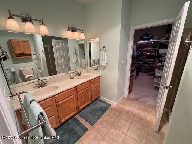 bathroom with tile patterned flooring and vanity