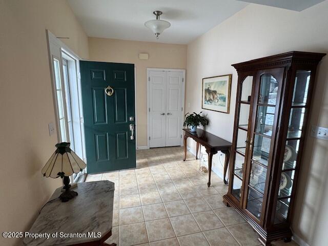 entryway with light tile patterned floors