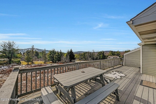 wooden terrace featuring a mountain view