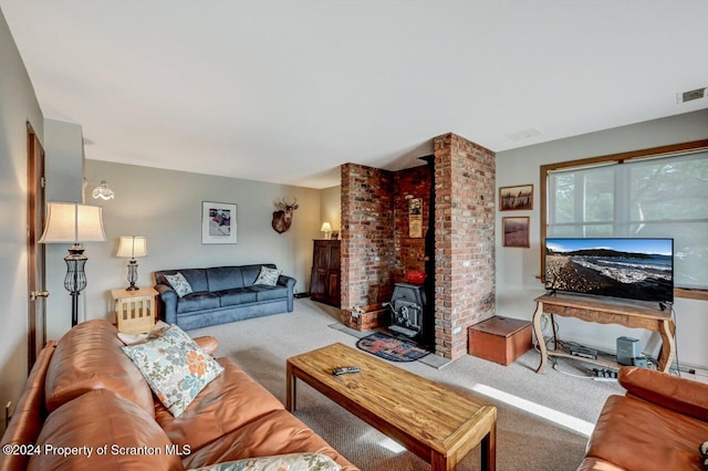 living room featuring carpet flooring and a wood stove