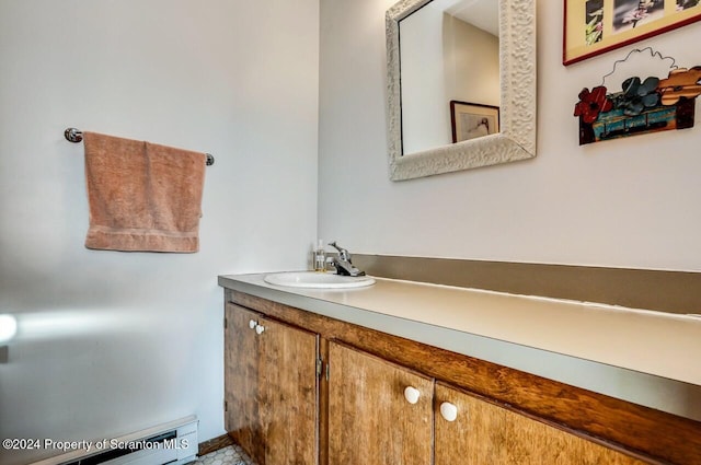 bathroom with vanity and a baseboard radiator