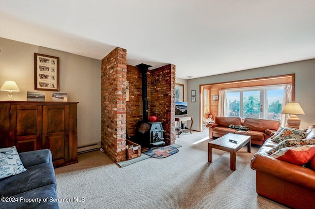 carpeted living room featuring a wood stove and a baseboard heating unit