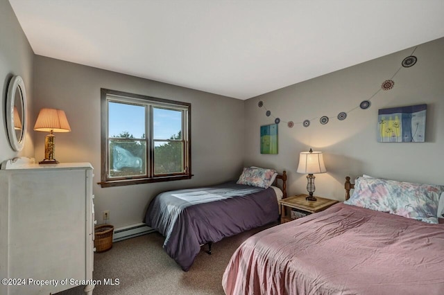 bedroom with carpet and a baseboard radiator