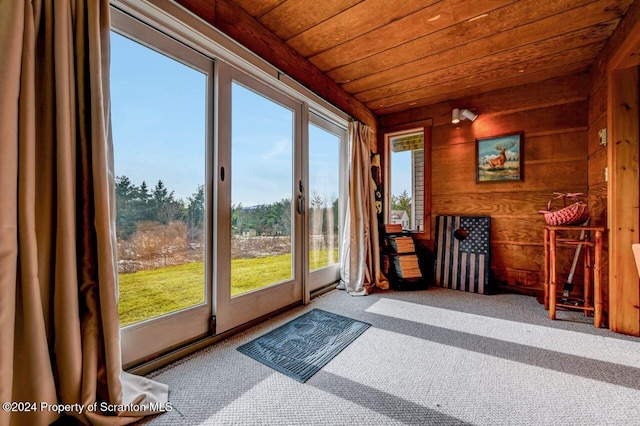 unfurnished sunroom with plenty of natural light and wooden ceiling