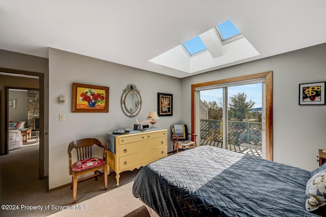 carpeted bedroom with access to outside and a skylight