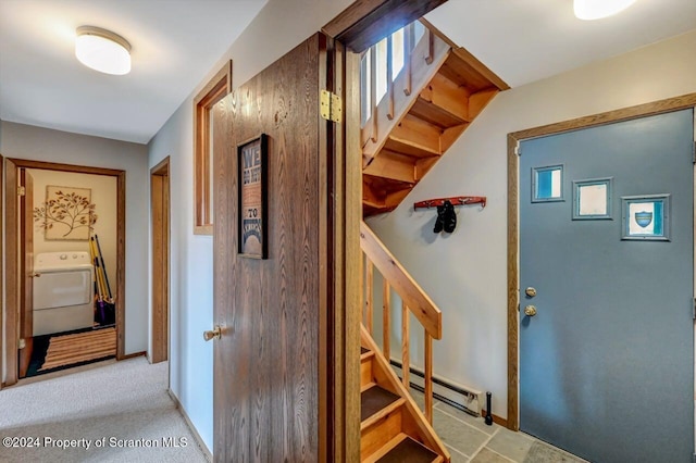 interior space featuring washer / clothes dryer and a baseboard heating unit