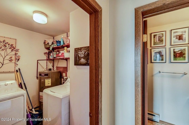 washroom featuring washer / clothes dryer, a baseboard heating unit, and water heater