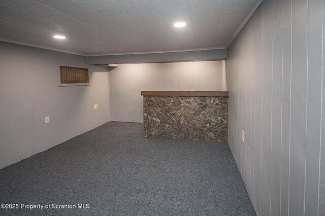 finished basement with carpet flooring, recessed lighting, and crown molding