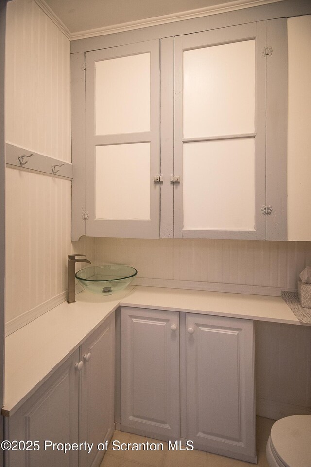 interior space with toilet and a sink