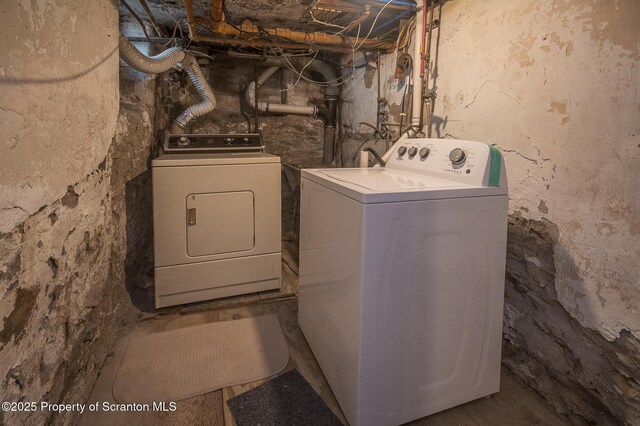 laundry area featuring washer and clothes dryer and laundry area