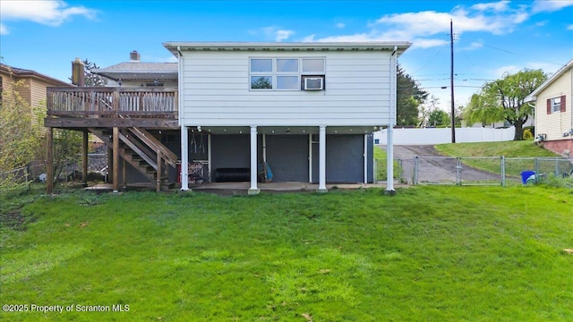 back of property featuring a gate, a deck, and stairs