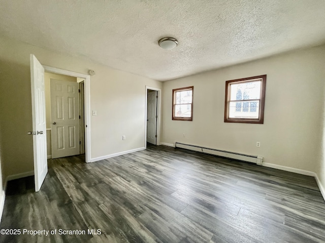 1211 Jackson St 1209-, Scranton, PA 18504 - unfurnished bedroom with a baseboard radiator, a textured ceiling, dark wood-type flooring, and baseboards