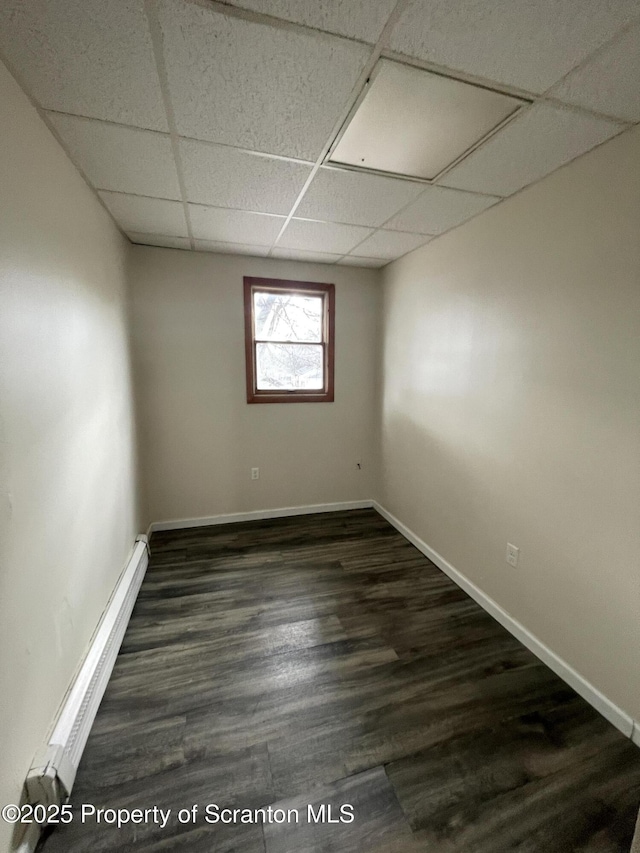 1211 Jackson St 1209-, Scranton, PA 18504 - unfurnished room featuring a drop ceiling, baseboard heating, baseboards, and dark wood-style flooring