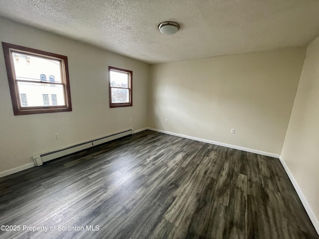 1211 Jackson St 1209-, Scranton, PA 18504 - empty room featuring baseboard heating, dark wood-style floors, a textured ceiling, and baseboards
