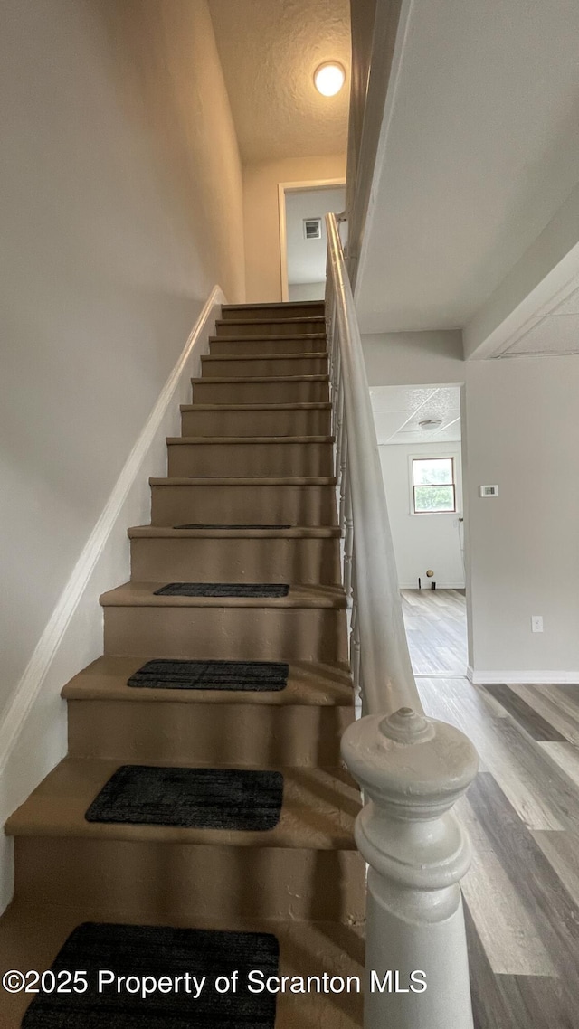 1211 Jackson St 1209-, Scranton, PA 18504 - staircase featuring wood finished floors and baseboards