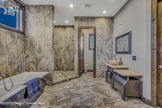 815 Oak St, Archbald, PA 18403 - full bathroom featuring visible vents, marble finish floor, recessed lighting, a freestanding bath, and vanity