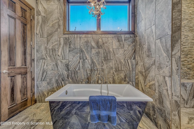 815 Oak St, Archbald, PA 18403 - bathroom with a bath and tile walls