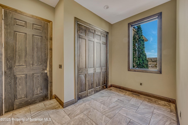 815 Oak St, Archbald, PA 18403 - unfurnished bedroom featuring a closet and baseboards