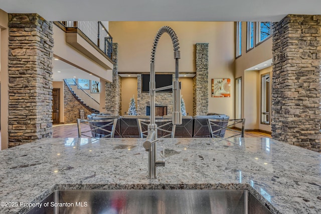 815 Oak St, Archbald, PA 18403 - kitchen with stone counters, baseboards, and a towering ceiling