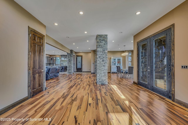 815 Oak St, Archbald, PA 18403 - interior space with recessed lighting, light wood-type flooring, ornate columns, and baseboards