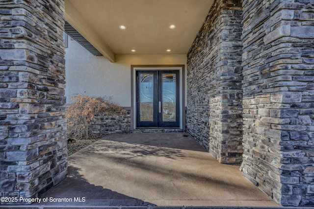 815 Oak St, Archbald, PA 18403 - entrance to property featuring stucco siding, stone siding, and french doors