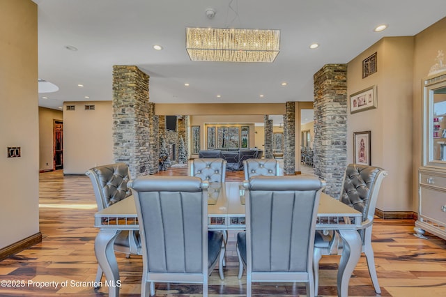 815 Oak St, Archbald, PA 18403 - dining area with a chandelier, recessed lighting, and decorative columns