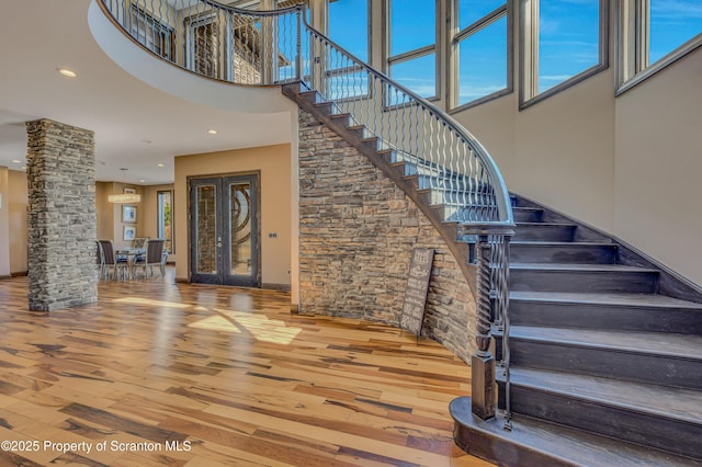 815 Oak St, Archbald, PA 18403 - stairway with recessed lighting, wood finished floors, and a towering ceiling
