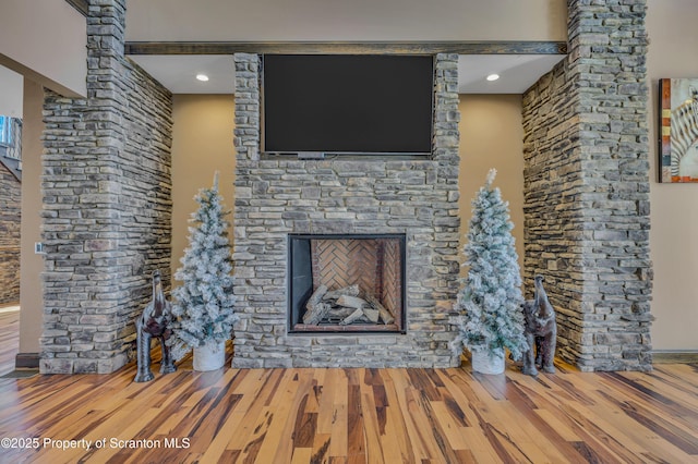 815 Oak St, Archbald, PA 18403 - unfurnished living room with wood finished floors, a fireplace, and ornate columns