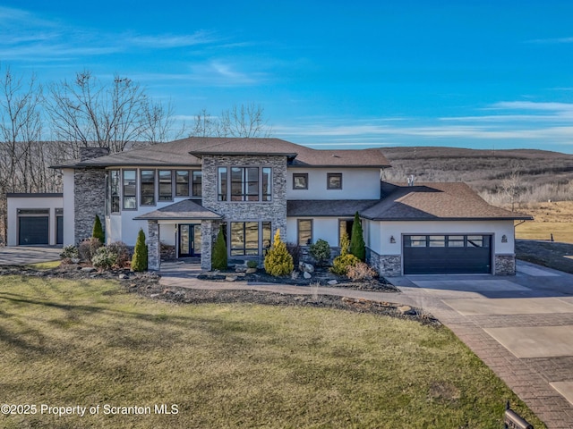 815 Oak St, Archbald, PA 18403 - view of front facade featuring stucco siding, stone siding, an attached garage, and a front yard