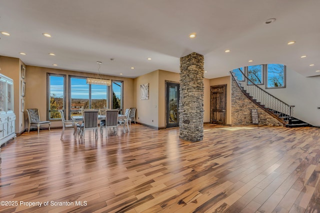 815 Oak St, Archbald, PA 18403 - living room with recessed lighting, decorative columns, wood finished floors, and stairway