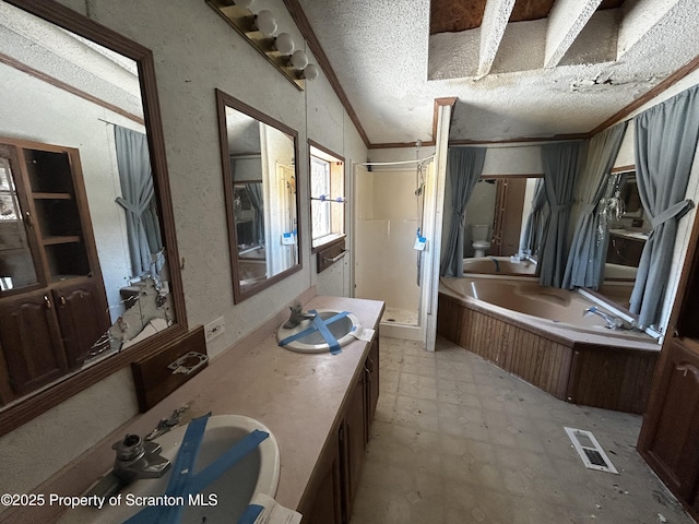 bathroom featuring a garden tub, visible vents, a stall shower, a textured ceiling, and tile patterned floors