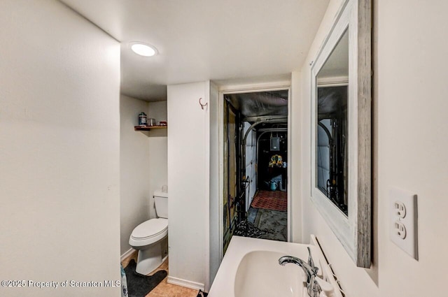 bathroom featuring sink and toilet