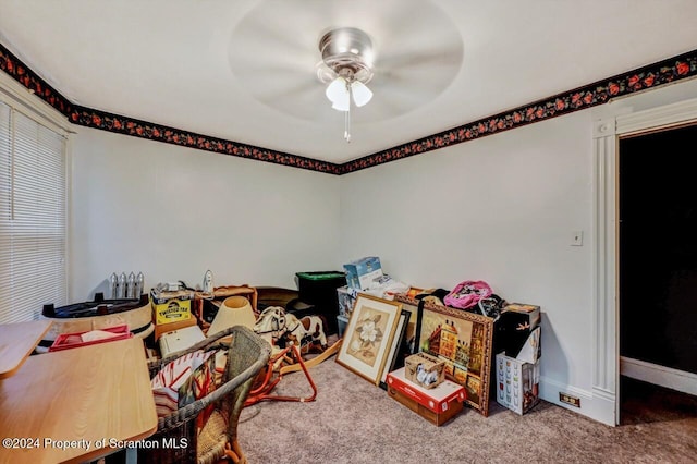 rec room with carpet flooring and ceiling fan