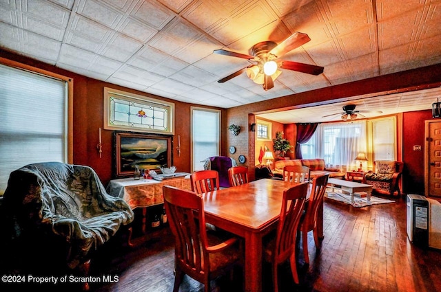 dining room with hardwood / wood-style flooring and ceiling fan