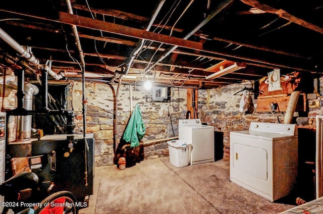 basement with washer and clothes dryer