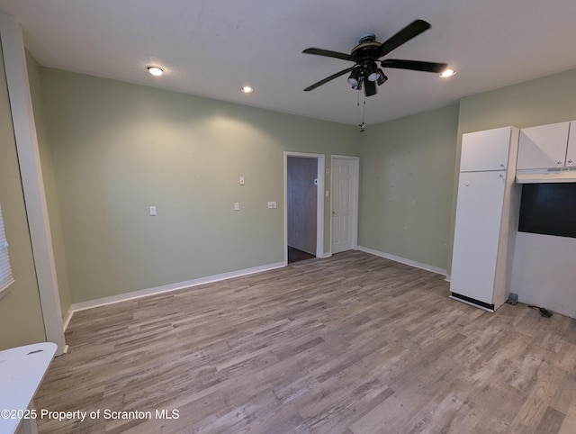 interior space with ceiling fan and light wood-type flooring