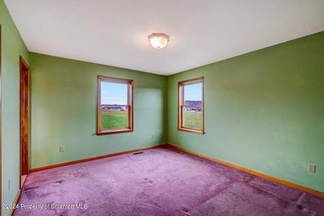 view of carpeted spare room