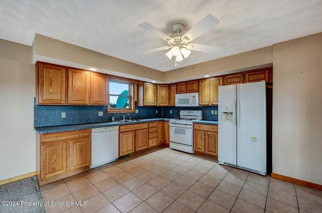 kitchen featuring ceiling fan, sink, tasteful backsplash, white appliances, and light tile patterned floors