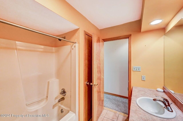 bathroom with tile patterned flooring, vanity, and shower / bath combination