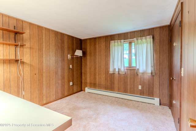 474 Tingley Lake Rd, New Milford, PA 18834 - carpeted empty room with a baseboard radiator and wood walls