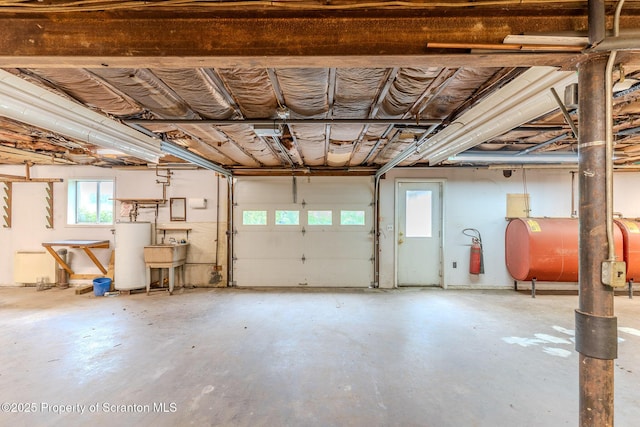 474 Tingley Lake Rd, New Milford, PA 18834 - garage featuring oil tank and water heater