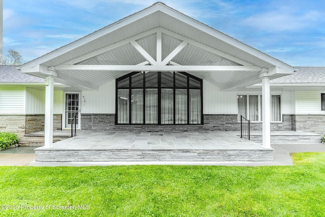 474 Tingley Lake Rd, New Milford, PA 18834 - rear view of property with roof with shingles, a porch, and a lawn