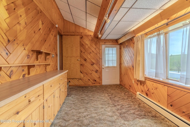 474 Tingley Lake Rd, New Milford, PA 18834 - hallway featuring a baseboard heating unit, carpet, and wood walls