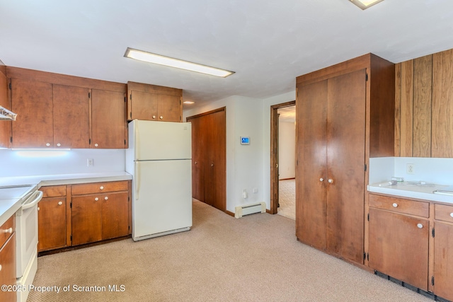 474 Tingley Lake Rd, New Milford, PA 18834 - kitchen featuring white appliances, light colored carpet, a baseboard radiator, brown cabinets, and light countertops