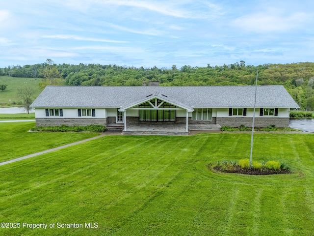 474 Tingley Lake Rd, New Milford, PA 18834 - view of front of property with a front yard, stone siding, and roof with shingles