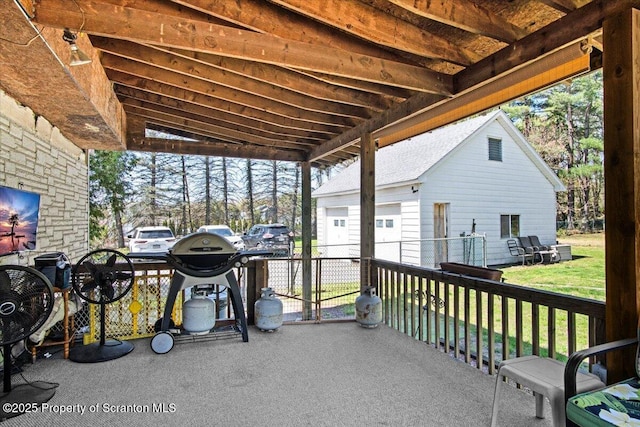 view of patio featuring a garage and grilling area