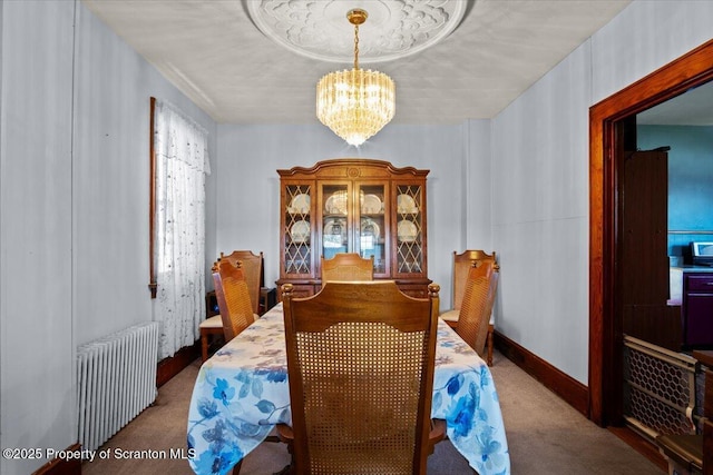 dining space featuring an inviting chandelier, carpet, and radiator heating unit