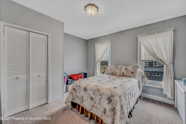 carpeted bedroom featuring a closet